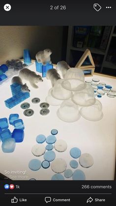 the table is covered with blue and white plastic objects