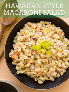 a bowl filled with macaroni salad on top of a table