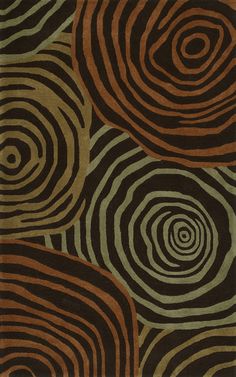 an area rug with different colored circles on the ground and black, brown, green, and tan colors