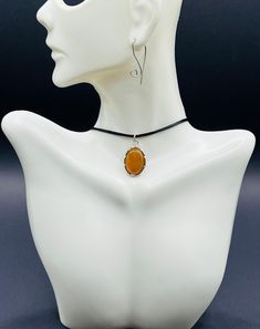 Elevate your accessory collection with a carnelian necklace that exudes vibrant energy and warmth. Pair it with a black cord necklace or a black cord choker for a sleek, modern look. For a unique twist, try a carnelian choker necklace that combines the boldness of carnelian with the simplicity of a black necklace. A 925 sterling silver carnelian pendant choker necklace will add a touch of elegance and sophistication to any outfit. Choose an adjustable necklace for versatile styling, whether laye Adjustable Gemstone Choker, Orange Choker Jewelry For Gift, Adjustable Orange Choker Jewelry, Carnelian Choker, Silver Y2k, Choker Necklace Black, Cord Choker, Black Cord Necklace, Carnelian Necklace