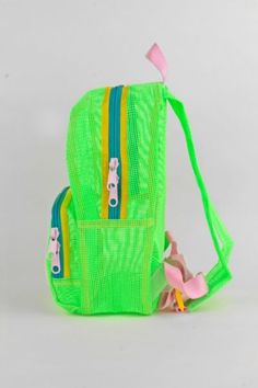 A great sporty style as a daily bag, beach buddy, or festival companion. This small backpack features a large front pocket with double zipper pull and main compartment. Super soft adjustable top loop & webbing. Content + Care Tear resistant 100% vinyl coated mesh Spot Clean Made in USA Size 13" height x 10" width x 4.5" main pocket depth, 1 lb 6" deep including front pocket | Mokuyobi Mesh Mini Backpack in Slime, Men's at Urban Outfitters Casual Backpack With Mesh Pockets For Daily Use, Green Summer Bags For Outdoor Activities, Green Bags For Summer Outdoor Activities, Sporty Green Backpack With Adjustable Strap, Green Bags For Outdoor Summer Activities, Playful Nylon Backpack, Playful Nylon Standard Backpack, Functional School Backpack For Summer, Outdoor Summer Standard Backpack