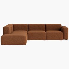 a brown sectional couch sitting on top of a white floor