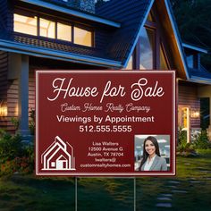 a real estate for sale sign in front of a house