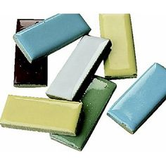 several different colored bars of soap on top of each other