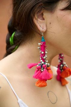 Earrings Color: Orange And Pink Material: Cotton Thnads Size: 5 Inch Quantity: 1 Wash & Care: Clean Spots And Dry Clean This product has been crafted by hand and may have slight irregularities or imperfections in color or embellishment. These irregularities are the result of the human involvement in the process and add to the finished products charm while ensuring you have one-of-a-kind piece. Bohemian Dangle Earrings For Navratri, Sari Silk Earrings, Bohemian Embroidered Drop Earrings, Multicolor Bohemian Hand-strung Earrings, Multicolor Embroidered Bohemian Earrings, Diy Fabric Jewellery, Diy Wire Earrings, Earring Crafts, Cartilage Earrings