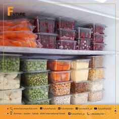 an open refrigerator filled with lots of food and veggies in plastic bins