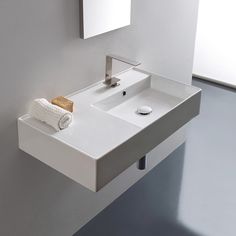 a bathroom sink with a towel and soap dispenser on the counter top