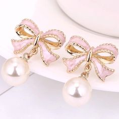 These Pink Bow Pearl Earrings Offer A Unique And Stylish Look That Will Make Any Outfit Stand Out. Crafted From A Pink Bow Design And Detailed With A Beautiful Pearl, They Are An Eye-Catching Accessory That Will Take Your Look To The Next Level. With A Lightweight Feel, These Earrings Are Comfortable To Wear All Day Long. The Perfect Finishing Touch To Any Girly Look, These Pink Bow Pearl Earrings Are Sure To Turn Heads. Get It Fast With 1-3 Day Priority Mail Shipping. Orders Are Packed & Shippe Pearl Pendant Earrings, Pearl Jewelry Gift, Long Tassel Earrings, Bow Earrings, Lovely Earrings, Pink Earrings, Girly Jewelry, Manado