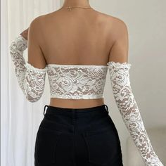 Steal the limelight with our beautiful underwire strapless crop top in solid white color. Designed to offer unmatched comfort, the top has an underwire support that keeps you secure throughout the day. But that's not all! The highlight of the crop top are its lace sleeves, bringing in an element of delicacy and charm to your look. Perfect for pairing with high waisted jeans or a chic skirt, it is an absolute must-have for your summer wardrobe! Color: WhiteSleeve Length: LongSilhouette: SheathType: Crop TopMaterial: PolyesterDecoration: LaceImported Update: This product is in high demand so you may experience a slight delay in shipping OUR PROMISE TO YOU: Easy Refunds. Buyer Protection. 30 Day Returns.Tracking Number for Every Order.Safe & secured payments via PayPal® & Shopify Payments whi Strapless Bra Friendly Crop Top For Party, Bra Friendly Strapless Crop Top For Night Out, Strapless Bra-friendly Crop Top For Party, White Stretch Tube Top Bra Friendly, White Strapless Bra For Summer, White Strapless Crop Top For Night Out, White Cropped Tube Top For Night Out, White Fitted Tube Top With Removable Bra Pads, White Stretch Tube Top For Night Out