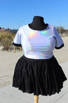 NOTE: All shirts are Currently Made To Order only with a 3 week turn around  Razzle Dazzle them in this truly holographic crop top with black accents on the cuffs, hems, and collar. Made from a comfy stretchy holo spandex this shirt can be customized with either a kawaii alien decal or an inverted star made from a super soft and stretchy elastic.  Relaxed measurement for the top is 42 inches across the bust and 19 inches from shoulder to hem Mannequin has a 50in bust and a 42 in waist for refere Kawaii Alien, Holographic Crop Top, Uchuu Kei, Plus Size Rave, Plus Size Tips, Edc Outfits, Plus Size Models, Plus Size Skirts, Rave Outfits