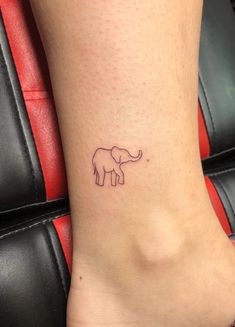 a small elephant tattoo on the ankle