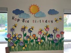 a birthday card with flowers and the words happy bee birthday on it, in front of a window