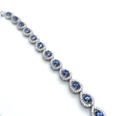 "Silver Open Pear Shaped Teardrop Solitaire Blue Tennis Bracelet Perfect For everyday wear a special occasion and makes the perfect gift. A fantastic piece sure to brighten up your wardrobe, this bracelet is simply gorgeous Minimalist and Stylish. Details:                 925 Silver               13.6 Grams               Measures 7.5mm Wide               7\" Long" Elegant Blue Diamond Bracelet As A Gift, Blue Sterling Silver Diamond Jubilee Bracelet, Blue Sapphire Diamond Bracelet Gift, Elegant Blue Diamond Bracelet In Sterling Silver, Blue Cubic Zirconia Sterling Silver Bracelet Gift, Elegant Blue Diamond Sterling Silver Bracelet, Blue Cubic Zirconia Fine Jewelry Bracelet, Elegant Blue Sterling Silver Bracelet As Gift, Elegant Blue Sterling Silver Bracelet For Gift