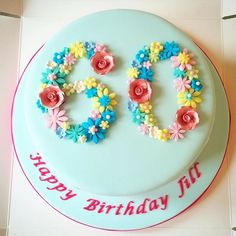 a birthday cake decorated with flowers and the number 30