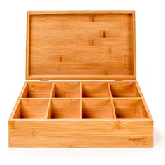 an open wooden box with compartments on the inside