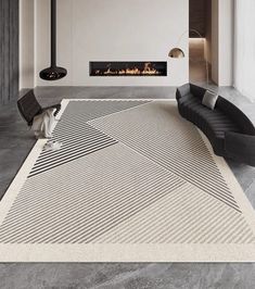 a modern living room with a fireplace and large rug