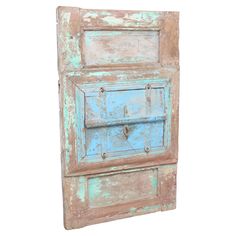 an old wooden door is painted blue