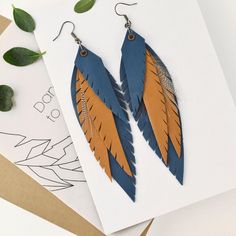 "Leather earrings, Blue lightweight leather earrings, Blue boho feather earrings, Boho earrings dangle, Leather teardrop earrings, Boho jewelry, Blue Leather Feather Earrings, Blue and orange-brown Long leather feathers earrings, Boho feathers Earrings,  Boho Festival earrings, Boho Leather Jewelry,  Gift  for her,  Natural Material Earrings, Blue and foxy brown Dangle Feather Earrings Long, dangle, bohemian feather earrings made with blue and orange-brown leather. Materials: leather, feather, s Blue Bohemian Leather Earrings, Bohemian Blue Leather Earrings, Blue Leather Bohemian Earrings, Boho Leather Jewelry, Bee Free, Festival Earrings, Leather Earring, Boho Feathers, Earring Ideas