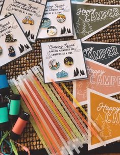 many different types of campers stickers and tags on a table with some scissors