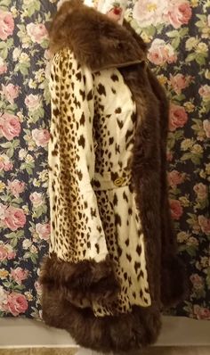 This coat is wildly fantastic in so many ways and will be a huge hit casual or dressed up. It has so much paxzaz going on from the fun animal print to the thick faux fur trim, gold button details, 70s collar and bell sleeves. Size small/medium Measurements: 34' long Shoulder to shoulder 16' Arms 22' Bell sleeves 8' Waist 15.5' Pit to pit 18' Light to Medium weight Made in Scotland Furrier cleaning recommended 70s Winter Outfits Vintage, Fitted Faux Fur Outerwear In Leopard Print, Fitted Leopard Print Faux Fur Outerwear, Fitted Leopard Print Winter Outerwear, Retro Fitted Fur Coat With Faux Fur Trim, Fitted Leopard Print Fur Coat For Fall, Fitted Retro Fur Coat For Fall, Vintage Leopard Print Winter Outerwear, Vintage Leopard Print Outerwear For Winter