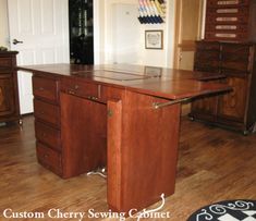 a large wooden desk sitting on top of a hard wood floor