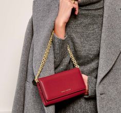 Say hello to your new BFF (Best Fashion Friend) - the Katie Loxton Rubi Crossbody Purse! Made from luxurious leather, this purse comes with a trendy chain strap for a hands-free experience. Perfect for a night out or when you want to add a touch of edginess to your outfit. Live life on the stylish side! Elegant Everyday Wallet On Chain With Chain Strap, Chic Formal Wallet On Chain With Mobile Phone Bag, Chic Formal Wallet On Chain With Phone Bag, Luxury Wallet On Chain For Workwear, Chic Wallet On Chain With Gold-tone Hardware For Travel, Chic Travel Wallet On Chain With Gold-tone Hardware, Chic Wallet On Chain With Mobile Phone Bag, Chic Wallet On Chain For Travel, Chic Travel Wallet On Chain With Detachable Strap