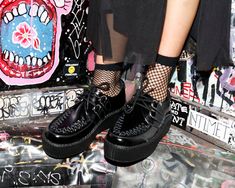 A classic never goes out of style! - These black leather T.U.K. Viva Mondo Creepers feature the new lightweight and more flexible soles in our traditional 1 7/8" Mondo height. These creepers have a black woven interlace, and silver metal D-rings. T.U.K. Creepers are sold and labeled in U.S. men's sizes- please see our size chart or the size drop down list to view U.S. women's size equivalents. Black Boots With Textured Sole For Streetwear, Black Streetwear Boots With Textured Sole, Black Sneakers With Lug Sole And Plain Toe, Black Plain Toe Sneakers With Lug Sole, Black Plain Toe Boots For Streetwear, Black Boots With Leather Sole For Streetwear, Black Round Toe Sneakers For Concert, Low-top Boots With Stitched Sole For Streetwear, Mens Creepers