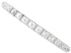 A stunning, fine and impressive antique Old cut 7.85 carat diamond and 18 karat white gold, palladium set bracelet; part of our diverse antique diamond bracelets collection. This stunning, fine and impressive antique diamond bracelet has been crafted in 18k white gold with a palladium setting. This impressive antique bracelet is composed with nineteen Old European round cut diamonds, totalling 7.85cts, individually pavé set to millegrain decorated square links. The bracelet secures with a push fit clasp to the reverse via a fully articulated, expandable spring-loaded strap composed of elongated links. The bracelet benefits from an additional hinged security catch and safety chain. The side of the bracelet strap is hallmarked with the 18k gold mark (18ct) and has been independently tested u Luxury Vintage Brilliant Cut Bracelets, Exquisite Hand-set Platinum Diamond Bracelet, Classic White Gold Diamond Bracelet, Rectangular Shape, Exquisite Diamond-cut White Gold Bracelets, Art Deco Platinum Diamond Cut Bracelet, Bracelets Collection, Set Bracelet, Expandable Bracelet, Antique Bracelets