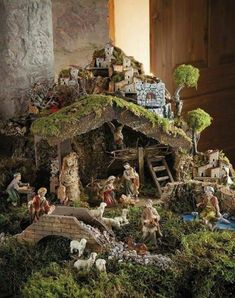 a nativity scene with figurines in the foreground