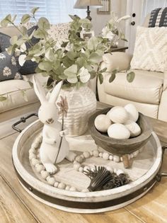 a living room filled with lots of furniture and decor on top of a wooden table