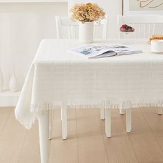 a white table and chairs in a room