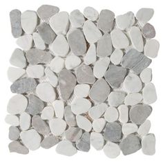 white and grey pebbles are arranged in a square pattern