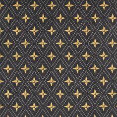 a black and gold tie with stars on it