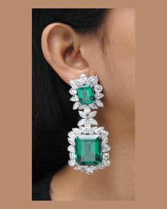 All of the products are MADE TO ORDER in India. They are handcrafted by me and my expert artisan team. *Gemstone Grade: AAAAA (Natural Diamond Coated) *Base Metal: 925 Sterling Silver *Plating: Rhodium Plated *Gemstone: Green Emerald          SKU : AAER_DE_257 ★ Each of our products is skin-friendly and eco-friendly. It does NOT contain nickel, cadmium, or lead. ★ Each order will be beautifully packaged for gift giving in a jewelry box.   Be sure to hit "favorite" on the right so it remains on y Green Sterling Silver Luxury Diamond Earrings, Luxury Green Sterling Silver Diamond Earrings, Luxury Green Diamond Earrings In Sterling Silver, Gia Certified Drop Jewelry For Formal Occasions, Formal Emerald Earrings With Gemstone Accents, Luxury Gia Certified Teardrop Jewelry, Elegant Emerald Earrings With Gemstone Accents, Dazzling Green Sterling Silver Jewelry, Formal Emerald Drop Jewelry