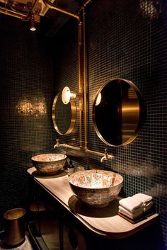 a bathroom with two sinks and a mirror