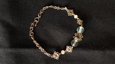 These unique  filigree bracelets are 100% handcrafted from alpaca (or nickel) silver wire. Approximate measurements: - Flourite (7mm) and gold rutilated quartz (3mm): 178- 185mm long - Garnet (4mm) and turquoise (3mm): 180- 203mm long - Lapis lazuli (5mm) and blue goldstone (3mm): 165- 211mm long - Black rutilated quartz (10mm) and pale rose quartz (5mm): 195- 215mm long These bracelets can be lengthened up to an inch at no charge. Handmade Metal Crystal Bracelet As A Gift, Elegant Silver Gemstone Charm Bracelet, Brass Bracelet With Natural Stones, Handmade Adjustable Sterling Silver Bracelet, Handmade Sterling Silver Bracelet For Gift, Elegant Brass Bracelets For Jewelry Making, Elegant Nickel-free Crystal Bracelet With Round Beads, Elegant Silver-color Brass Bracelets, Handmade Elegant Brass Bracelet