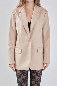 Up your style game with this Faux Leather Blazer and accomplish a chic, put-together look. Designed with shoulder pads, flap pockets, and notch lapels, this blazer will become your new go-to piece. Style it with a tweed dress, for work, or pair it with your favorite jeans, and a crop top, for drinks with friends. Faux leather Notch lapel Shoulder pads Front darts Single breast 3 Buttons Lined jetted pockets with flaps Chest pocket Single vent Single-button closure Functional buttons on sleeves B Knit Bottom, Tweed Dress, Blazer And Shorts, Heat Styling Products, Leather Blazer, Romper With Skirt, Summer Tops, Favorite Jeans, Sweater Top