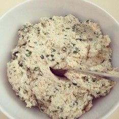 a white bowl filled with food on top of a table