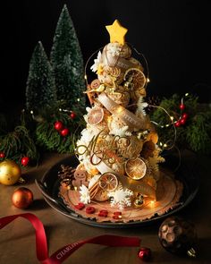 a christmas tree made out of cookies on a plate