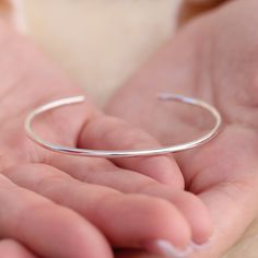 These matte silver bangle cuffs have a soft and luminous shimmer that is elegant and feminine. They have a comfortable fit that is custom tailored to your wrist size and a recycled sterling silver body that will last. This cuff is 2mm thick and is a strong and simple cuff bracelet. Silver Bodies, Silver Bangle, 5 S, Recycled Sterling Silver, Custom Tailoring, Silver Bangles, Silver Cuff, Silver Bracelets, The Drop