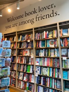 there are many books on the shelves in this book store that says welcome book lover, you're among friends