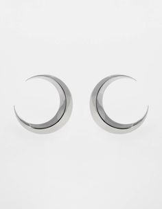 Symmetrical moon-shaped earrings made of sterling silver or sterling silver plated with 24 ct gold. Motif diameter: 24 mm. Decorative engraving on the reverse.We observe the phases of the Moon on Earth trying to solve the mystery of lunar attraction, but one side of this peculiar celestial body is always hidden in the shade of the Sun.