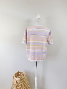 "Vintage 1990s Cathy Daniels Horizontal Ribbed Striped White Pink Knitted Shirt Short Sleeve Top Tee Blouse Sz Large This top is used but in good condition with no odors, tears, or repairs. Appropriate for any casual, or evening occasion. This top measures: Bust: 44\" Waist: 44\" Top to Bottom: 22.5\" (Measurements are taken across item laying flat and are then doubled.) Thanks for looking! Domestic Shipping: First Class (2-5 days) International Shipping: First Class (based on weight). I ship al 90s Striped Crew Neck Top, Striped Cotton Knit Top With Crew Neck, Striped Cotton Crew Neck Knit Top, Striped Knit Tops With Short Sleeves, Retro Knit Tops For Spring, Pink Short Sleeve Cotton Sweater, Pink Cotton Short-sleeved Sweater, Retro Short Sleeve Knit Tops, Retro Knit Short Sleeve Tops