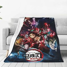 an anime character blanket on a couch