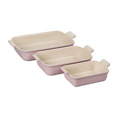 three pink casserole dishes sitting side by side