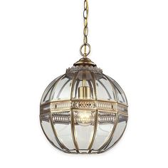 an antique brass finish hanging light with clear glass globe shades and gold chain, on a white background