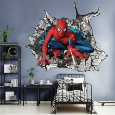 the amazing spider - man smashed wall decal is shown in this room with a bed and