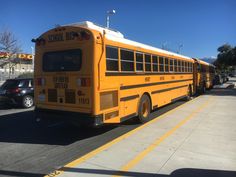 a yellow school bus parked in a parking lot