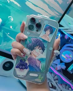 a woman holding up an iphone case with anime characters on the front and back cover