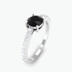 Product Details Flaunt her style with this lovely and amazing Solitaire Promise Ring as a birthday gift. This Promise Ring for Women is beautifully crafted with Round Shape Black Onyx as a solitaire in a designer setting with Round Diamond in a Side Stones. This December Birthstone Ring is mounted in gold metal. Product Information SKU SHP-RINGS032218926 Weight 1.68 gm (Approximate) BLACK ONYX INFORMATION No.of Stones 1 Pieces Total Weight 0.45 Carat (Approximate) Dimension(approx) Round-5X5 mm- December Birthstone Ring, Ring With Diamond, Signature Jewelry, Timeless Jewelry, December Birthstone, Ring For Women, Birthstone Ring, Conflict Free Diamonds, Promise Ring